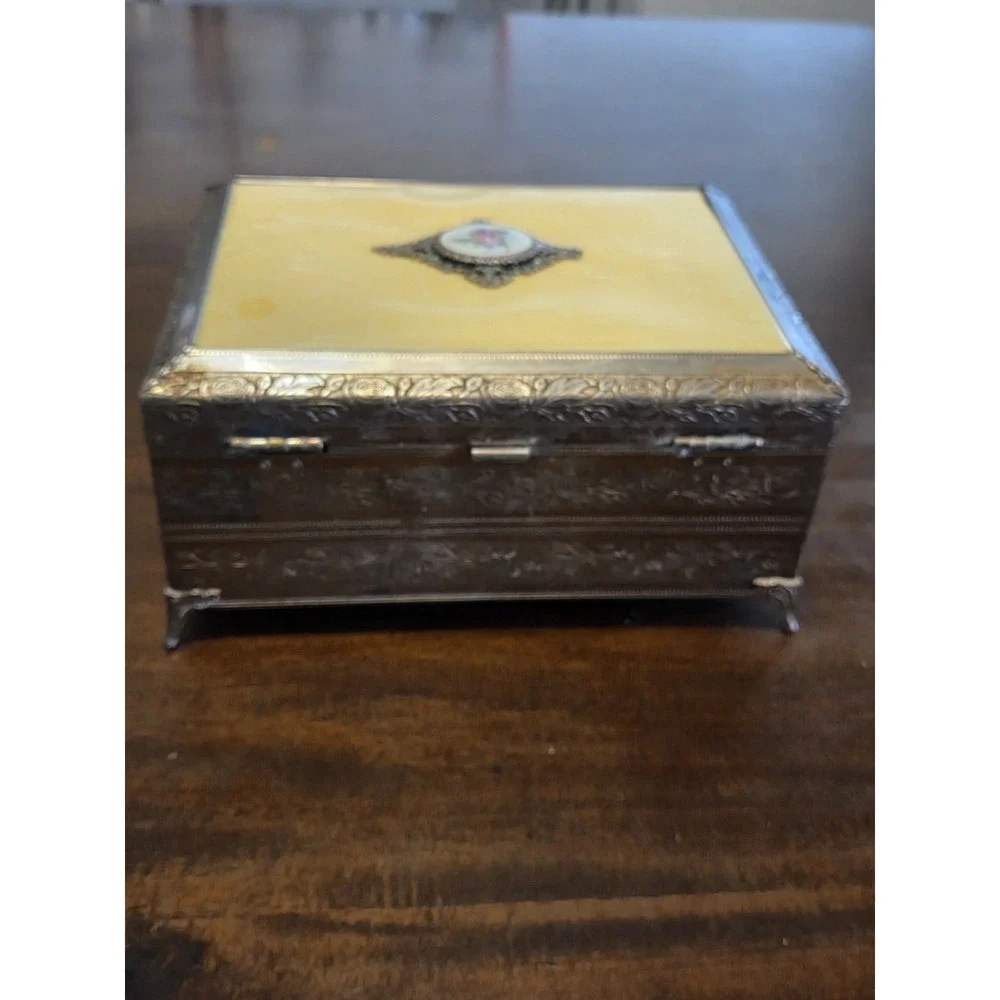 antique etched brass trinket box features a hinged lid Music Box